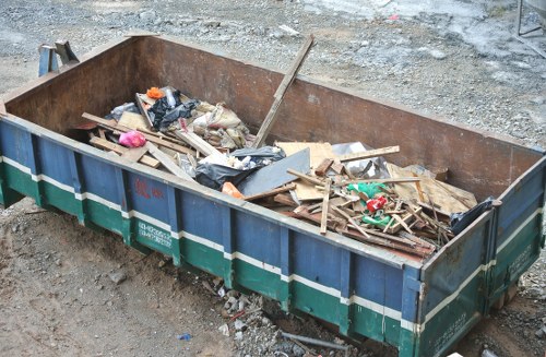 Rubbish removal team handling waste in Holloway