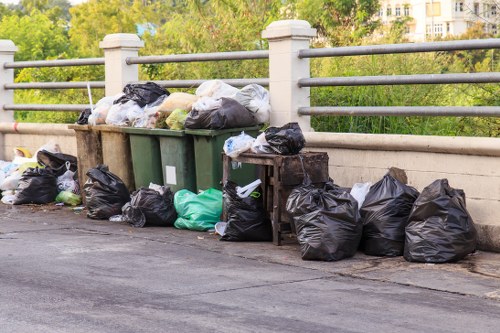 Homeowner preparing items for rubbish removal service